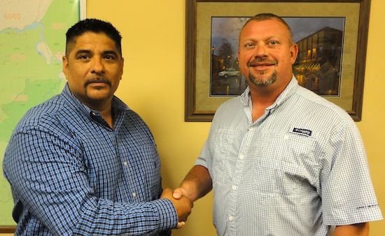 Albert Medina being congratulated by Sheriff Tommy Jones