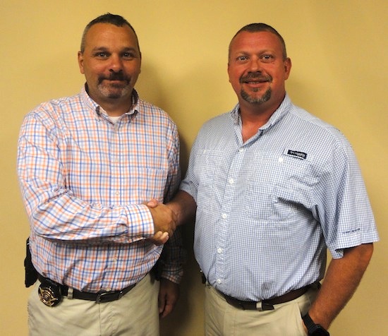 Sheriff Tommy Jones congratulates Chris White on his promotion to Chief Deputy