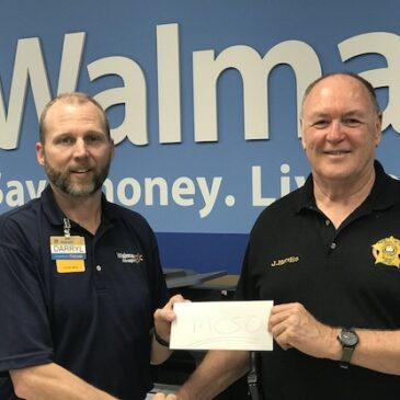 Left to Right - Walmart Store Manager Darryl Lyons and Auxiliary Captain James Hardin 