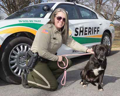 Sam with dog and police car