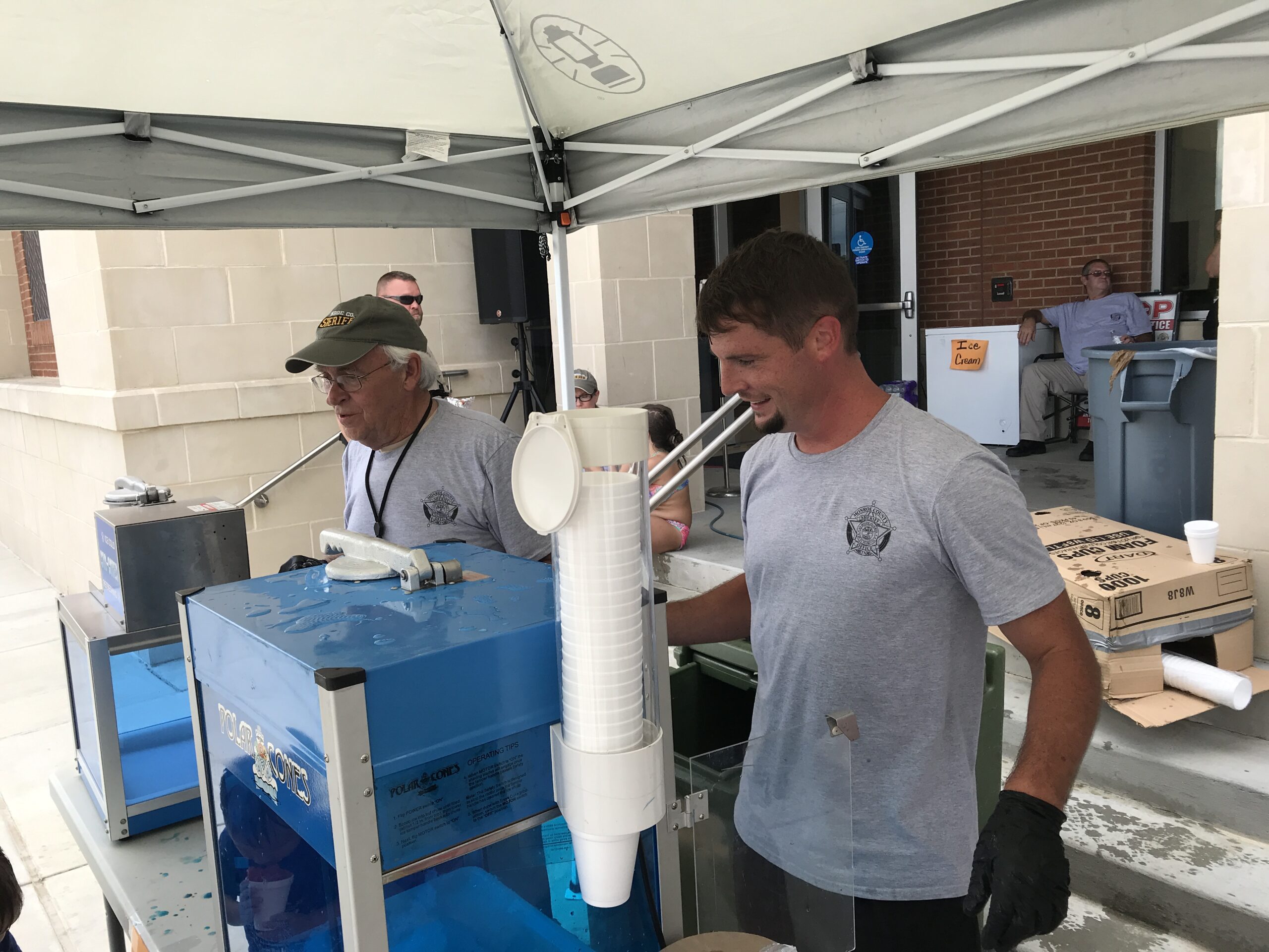 Steve Ogle and Jim Wall serve Snow Cones